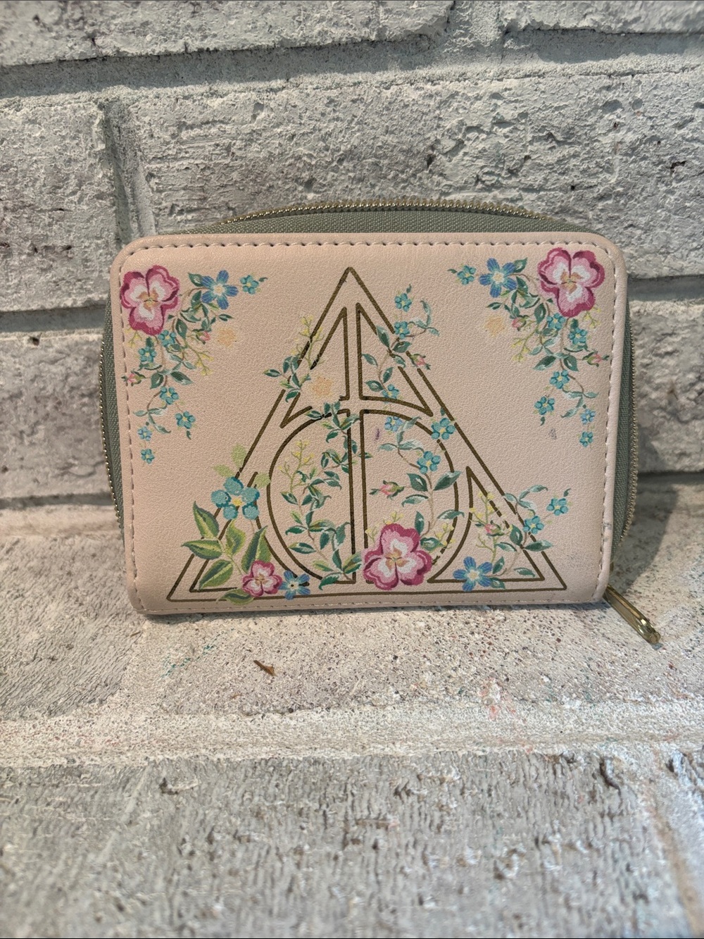 Loungefly Harry Potter Zip Card Holder with Deathly Hallows emblem.